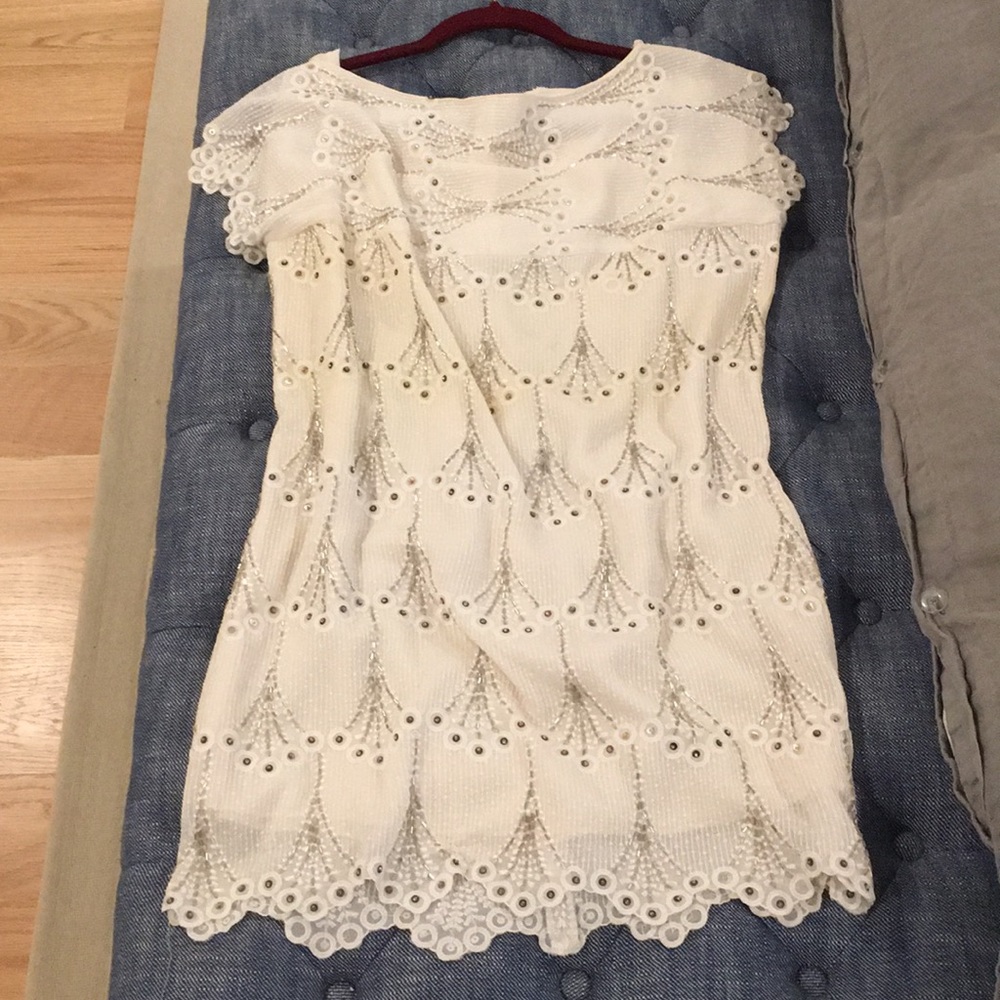 Vintage dress with hand beading details.